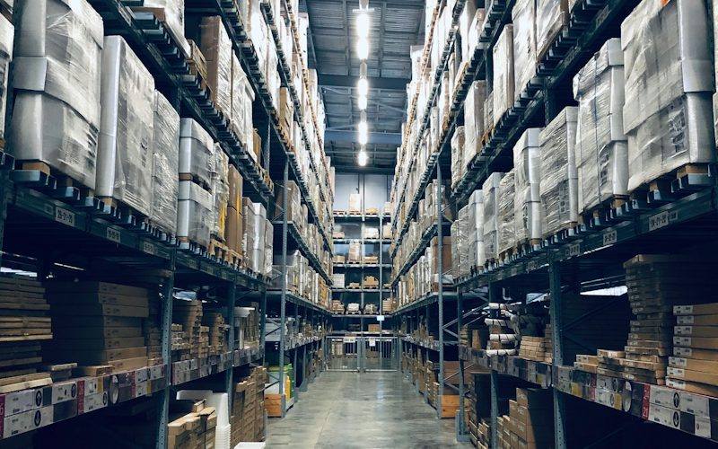 Pallet racking aisle stocked with inventory for stock control